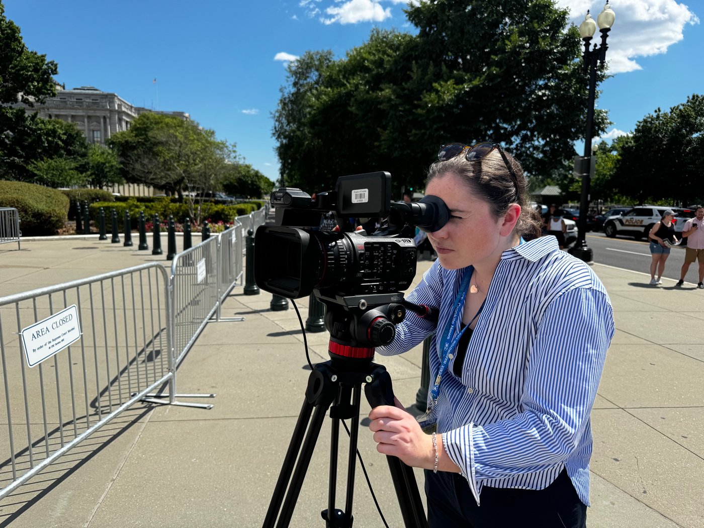 Aoife Kane filming with a Canon camera near the U.S. Capitol